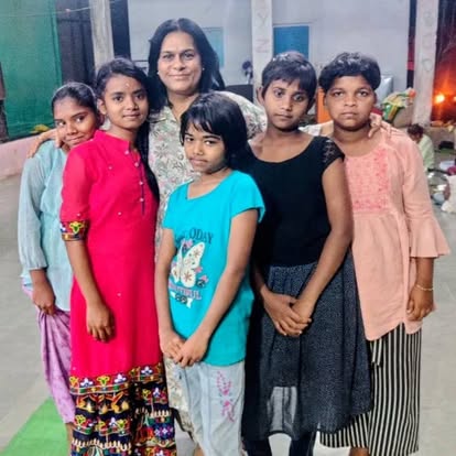 Women and girls standing together