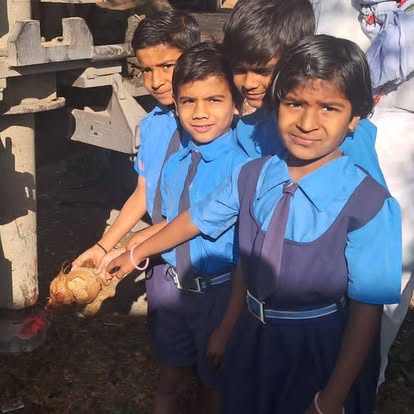 Schoolchildren holding the harvest