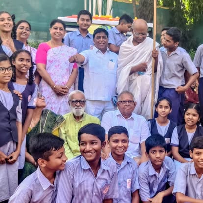 Elders, women and children gathered together at a community event